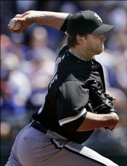 White Sox pitcher Mark Buehrle pitches to Royals lead-off batter Tony Graffanino. Buehrle pitched eight shutout innings in Chicago's 3-1 victory Sunday in Kansas City, Mo.
