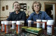 Max and Donna Dougherty are shown in their Bedford, Iowa, home with the prescription medications that Max takes. The Doughertys are pleased with the new Medicare prescription program, saying it saves them up to $350 a month.