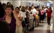Voters line up to vote on the last day of early voting for the upcoming election at City Hill in New Orleans on Saturday April 15, 2006. New Orleans displaced by Hurricane Katrina have been lining up to cast their absentee ballots in the April 22, city elections.