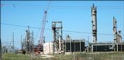 City and County commissioners are considering whether to purchase the site of the former Farmland Industries plant on the east edge of Lawrence. Officials are reviewing a report about the necessary environmental cleanup at the site along Kansas Highway 10 before making a decision.