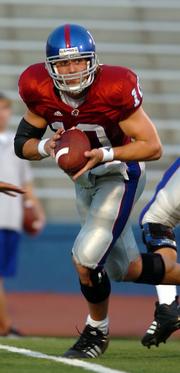Kansas quarterback Kerry Meier scrambles during the KU spring football scrimmage. Meier showcased his running and throwing during the game a week ago today at Memorial Stadium.