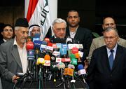 Iraqi political parties agreed to postpone their scheduled parliament session until Saturday after Prime Minister Ibrahim al-Jaafari cleared the way for Shiite leaders to withdraw his nomination for a second term. From left, Iraqi Sunni politician Adnan al-Dulaimi, Parliament Speaker Adnan Pachachi and Iraqi President Jalal Talabani announced the postponement Thursday in Baghdad, Iraq.