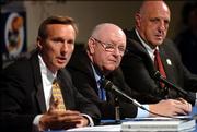 Kansas University chancellor Robert Hemenway, center, and athletic director Lew Perkins, right, listen as Rick Evrard, an Overland Park lawyer answers questions during a news conference Friday concerning the NCAA's response to Kansas' self report Friday morning in Hadl Auditorium. Last summer KU reported several NCAA violations that were investigated by Evrard's Overland Park based firm.