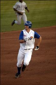 John Milner heads to third base after a hit in the third inning. Milner drove in two runs on his double but was thrown out trying to advance to third base.