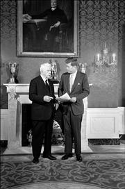 President John F. Kennedy and poet Robert Frost chat in the green room of the White House under a portrait of John Quincy Adams. The 85-year-old poet who delivered one of his own works at Kennedy's inauguration, was the first scheduled visitor on January 22, 1961 to the White House. The John F. Kennedy Library and Museum has obtained the original version of the poem that Frost prepared for the inauguration of John F. Kennedy, but never read in its entirety because of the glare of the sun.