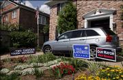 A house in the Uptown area of New Orleans, has signs for both candidates after last night's primary election on Sunday, April 23, 2006. New Orleans Mayor Ray Nagin will face Lt. Gov. Mitch Landrieu in a runoff election on May 20th.
