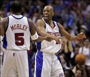 Los Angeles Clippers Sam Cassell, right, celebrates with teammate Cuttino Mobley after successful defense against the Denver Nuggets in the first quarter of their first round Western Conference playoff basketball game, Monday, April 24, 2006, in Los Angeles.