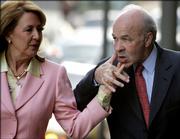 Enron founder Kenneth Lay keeps hold of his wife Linda's hand on their to the federal courthouse on the first day of the 13th week of his fraud and conspiracy trial Monday, April 24, 2006 in Houston. Lay is expected to take the stand later in the day.