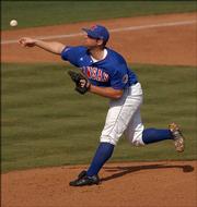 KU's Kodiak Quick throws a pitch against Oklahoma. Quick picked up the win in the second game of Sunday's doubleheader at Hoglund Ballpark. KU won the nightcap, 7-5, after losing the opener, 17-2.
