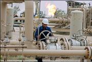 An Iraqi works on an oil and gas facility near Basra, Iraq's second largest city, in the south of the country. According to a reconstruction progress report being released today, dozens of firehouses and hundreds of police stations have been rebuilt in Iraq, thousands of schools are fixed and millions more Iraqis have access to cellular telephones. But oil and gas production, which fuels Iraq's fragile economy, has yet to return to levels before the U.S.-led invasion in March 2003.