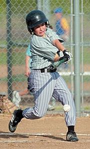 Panthers pitcher P.J. Budenbendur sends a ground ball to first base during the first inning. Budenbendur hit a triple later in the game helping the Panthers to a big victory against the Comets.