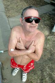 John Schneider - better known as the Tan Man during the 1970s and 1980s in Lawrence - now lives in shirted obscurity. For years he was a Lawrence icon, frequently seen running around town shirtless while soaking up the sun, even during cold weather, or lounging on the grass in summer shorts near Wescoe Hall on the Kansas University campus.