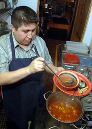 Angel Alvarez, owner of Tortas Jalisco, 534 Frontier Drive, serves up a steaming bowl of menudo after it's been simmering for at least three hours. The key ingredient in the traditional Mexican soup is beef tripe, or the lining of a cow's stomach.