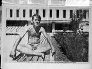 A photo from Schneider's scrapbook shows him in a familiar perch outside Kansas University's Wescoe Hall.