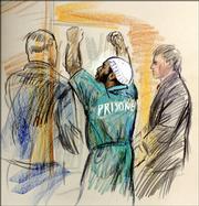 This artist's rendering shows Zacarias Moussaoui celebrating as he is taken from the courtroom at U.S. District Court in Alexandria, Va., after the jury in the sentencing trial of the convicted al-Qaeda conspirator sentenced him to life in prison, Wednesday, May 3, 2006.