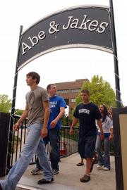 Members of the Free State High School prom court leave a Thursday afternoon pre-prom meeting at Abe & Jake's Landing. Several incidents in recent years at the bar have made news, which is a concern for Lawrence officials because the building is owned by the city and leased to Mike Elwell.