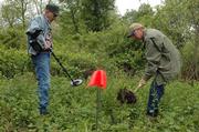 Dick Harmon and Tom Thiessen, workers from Lincoln, Neb., dig at the site of the Battle of Black Jack. Volunteers came Thursday morning to clean and look for signs of the former battleground east of Baldwin.