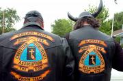Wade "Cream Puff" Burenheide, left, Baldwin, and Mark "Buffalo" Halford, Lawrence, show their Christian Motorcyclists Assn. leather jackets Thursday before riding.