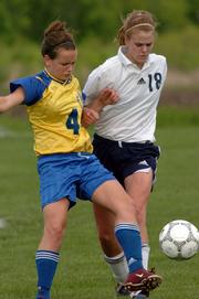 Seabury's Academy's Arielle Spiridigliozzi puts pressure on Center Place's Meridith Stary. The Seahawks rallied Thursday for a 4-3 victory at the Youth Sports Inc. fields.