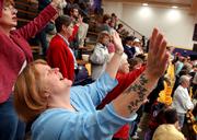 Lawrence resident Carla Parris worships along with hundreds of other attendees at a National Day of Prayer ceremony Friday night at Haskell Indian Nations University.