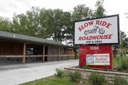 North Lawrence businesses Slow Ride Roadhouse Bar & Grill and Combs Custom Cycles, below, look to benefit from the opening of Riverfront Harley-Davidson.