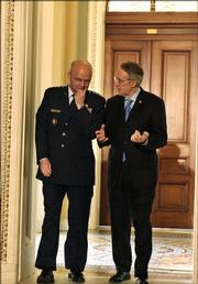 CIA Director nominee Gen. Michael Hayden, left, talks with Senate Minority Leader Harry Reid of Nev. on Capitol Hill Friday, May 12, 2006.