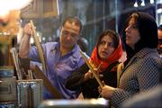 Iranian women buy traditional handmade frames in a bazaar in Isfahan some 400 kms (240 miles) south of Tehran, Iran, on Wednesday May 10, 2006.