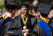 George Gaines, center, accepts a doctor of law degree from University of Missouri chancellor Brady Deaton, left, Saturday, May 13, 2006. at the honors commencement ceremony on the Columbia, Mo. campus. Gaines accepted the degree for his uncle, Lloyd Gaines, who mysteriously disappeared 67 years ago, while the courts fought over his effort to integrate the campus.