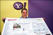 Dan Rosensweig, Yahoo's chief operating officer. holds a copy of their new home page at Yahoo! headquarters in Sunnyvale, Calif., Monday, May 15, 2006. Internet powerhouse Yahoo Inc. unveils the most extensive makeover of its front Web page in a decade, offering 402 million users more interactive features and more information compiled from the activity in other sections of its site.