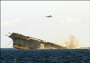 The USS Oriskany slips beneath the surface of the Gulf of Mexico, approximately 24 miles off the coast of Pensacola, Fla. The 888-foot aircraft carrier sank in about 37 minutes, more than four hours faster than predicted, forming the world's largest deliberately created artificial reef.