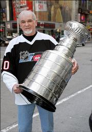 Stanley Cup, the man, poses with Stanley Cup, the trophy. Cup, a steelworker from Saltsburg, Pa., has done hockey promos for Outdoor Life Network.