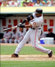 Giants slugger Barry Bonds connects on career home run No. 714 off Oakland pitcher Brad Halsey. Saturday's bomb in Oakland, Calif., moved Bonds into a tie with Babe Ruth for second place on the career chart.