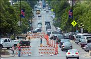 In a view from atop City Hall, southbound traffic is confined to one lane between Eighth and Ninth streets and again between 10th and 11th streets. Construction crews began work Monday on the downtown waterline project, which is expected to last until mid-September.