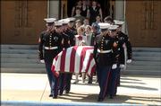 The casket of Lance Cpl. Christopher Brandon Wasser, of Ottawa, is carried from Ottawa University Chapel during memorial services April 17, 2004. Nearly 1,000 people attended the service to pay tribute to Wasser, who was killed April 8, 2004, by a roadside bomb in Iraq.