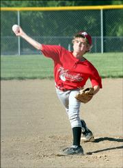 Hawks pitcher Sam Hearnen heaves the ball toward home plate Wednesday at 4-H Cowser Field in a 12U game against the Dynasty. The Hawks made a comeback to take a one-point victory.