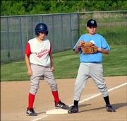 The Sidewinders third baseman keeps the Cardinals runner in check by keeping his foot on the base May 22 at Youth Sports Inc.