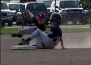 Rough Rider Gage Nelson swipes second base in the first inning against the Titans. Nelson would steal his way home that inning, and the 10U Riders would go on to win 16-1 at Youth Sports Inc.