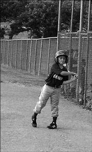 Raptor Tanner Green warms-up with a swing before he steps up to bat at home plate. The Raptors won their game against the Suns, 14-6.