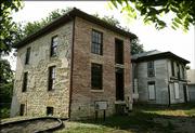 History buffs are hoping to restore the 150-year-old home, left, which was a stop on the Underground Railroad. The home next door would be used as a visitors' center. The project would be part of a proposed Bleeding Kansas National Heritage Area covering 26 counties.