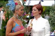 Zoe Lucker portrays Tanya Turner, left, with Alison Newman as Hazel in a scene from the BBC America series "Footballers Wive$." While ABC's "Desperate Housewives" are away for the summer, the glitzy British series about very bad behavior in the soccer world returns for a fourth season.