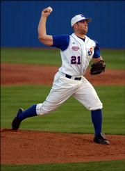 Kansas University senior pitcher Kodiak Quick makes his move toward home plate in the top of the fourth inning. The Jayhawks faced off against the Bradley Braves Friday night at Hoglund Ballpark.
