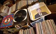 An Elvis Christmas Album and selected speeches of John F. Kennedy rest among the piles of albums up for auction.