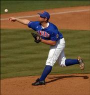 KU pitcher Kodiak Quick throws a pitch against Oklahoma. The Jayhawks played a double header Sunday afternoon at Hoglund Park.