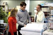 French actors Solene Bouton, left, Xavier Robic, center, and Francois Berleand, are seen in this Dec. 21, 2005 picture, supplied by Canal Plus, in a scene from the French adaption of the classic British comedy "The Office." Judging by the hilarious French version, workers pretty much complain about the same things as their English counterparts: a lunatic boss, exasperating co-workers and generalized boredom. "Le Bureau," which premiers this week on Canal Plus, is the first time that the BBC comedy which also spawned an American verion on NBC last year has been translated.