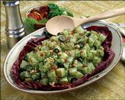 This photo provided by the Idaho Potato Commission shows Italian Basil Potato Salad, made with a recipe that picks up on Americans' longtime affection for Italian cooking.