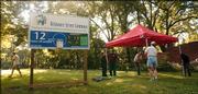 Members and supporters of Delaware Street Commons, a planned co-housing development near the intersection of 12th and Delaware streets, set up for a ground-breaking ceremony in this September 2004 file photo. This month, they plan to start construction, with all 23 residences set for completion within 10 months.