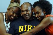 Wayne Ricks, center, gets a lot of attention from his two daughters Cherrale, 20, left, and Kizzie, 25. Cherrale plays basketball for Park University in Parkville, Mo., and Kizzie teaches and coaches at French Middle School in Topeka.