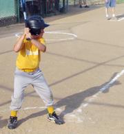8U DCABA Piston Brad Kincaid steps up to take a swing in the second inning of the Pistons match-up with the Clippers. Kincaid hit a homerun off of his swing on June 12 at 4-H Fenway Field.