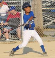 Royal Terrell Burnett swings for the fences at Holcom Blue Field on Thursday. Burnett had a walk and two stolen bases against the Yankees in a 9-7 Royals victory.