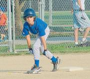 Royal Jon Doll prepares to take off for home in the bottom of the third against the Yankees in Jhawk League action. He would score the tying run on a Elijah Penny double as the Royals went on to win 9-7.
